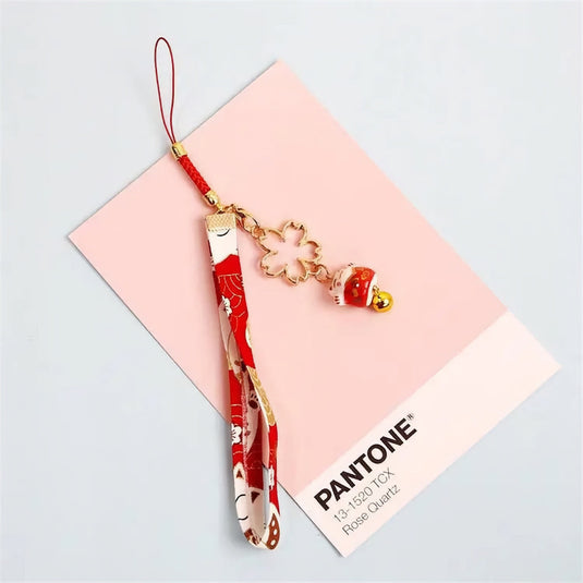 Accessoire de téléphone protecteur : porte-bonheur nippon rouge avec grelot