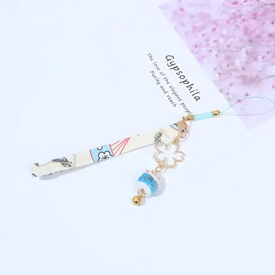 Accessoire de téléphone porte-bonheur japonais blanc avec petit grelot