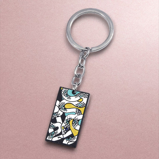 Porte-clés Demon Slayer Iguro - Personnalisez votre trousseau de clés avec ce porte-clés en métal aux couleurs éclatantes, un produit japonais qui rend hommage à l'un des personnages marquants de l'animé