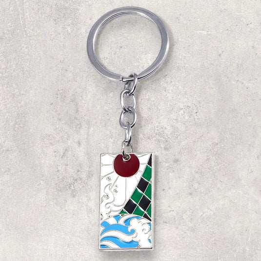 Porte-clés Coloré Tanjiro - Emportez l'esprit de Tanjiro partout avec vous grâce à ce porte-clés métallique aux couleurs vives de 3,5x2 cm, un hommage au personnage adoré de Demon Slayer